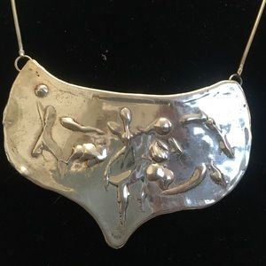 Sterling silver pendant by Joanne Cooper created in 1975.